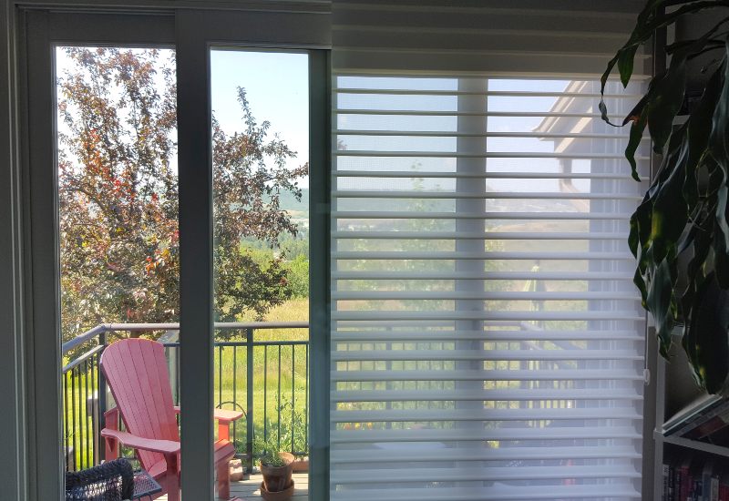Sheer white blinds on patio door with outdoor view and chairs, Tucson, AZ